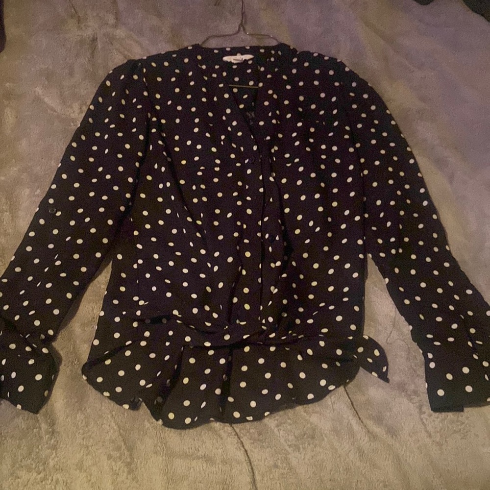 Black blouse with white polka dots.